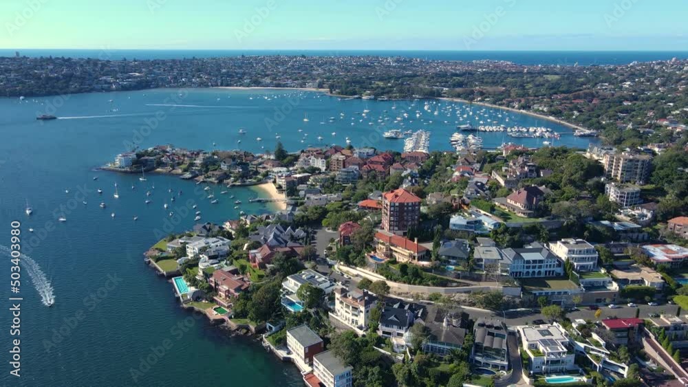 Aerial drone view of harbour side suburb of Point Piper in East Sydney, NSW, Australia heading toward Rose Bay in the background on a sunny day 