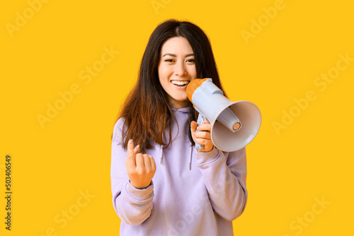 Young Asian woman with mega...