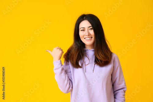 Inviting young Asian woman ...