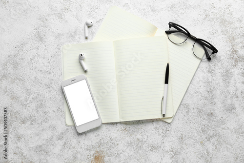 Notebooks, phone, glasses, ...