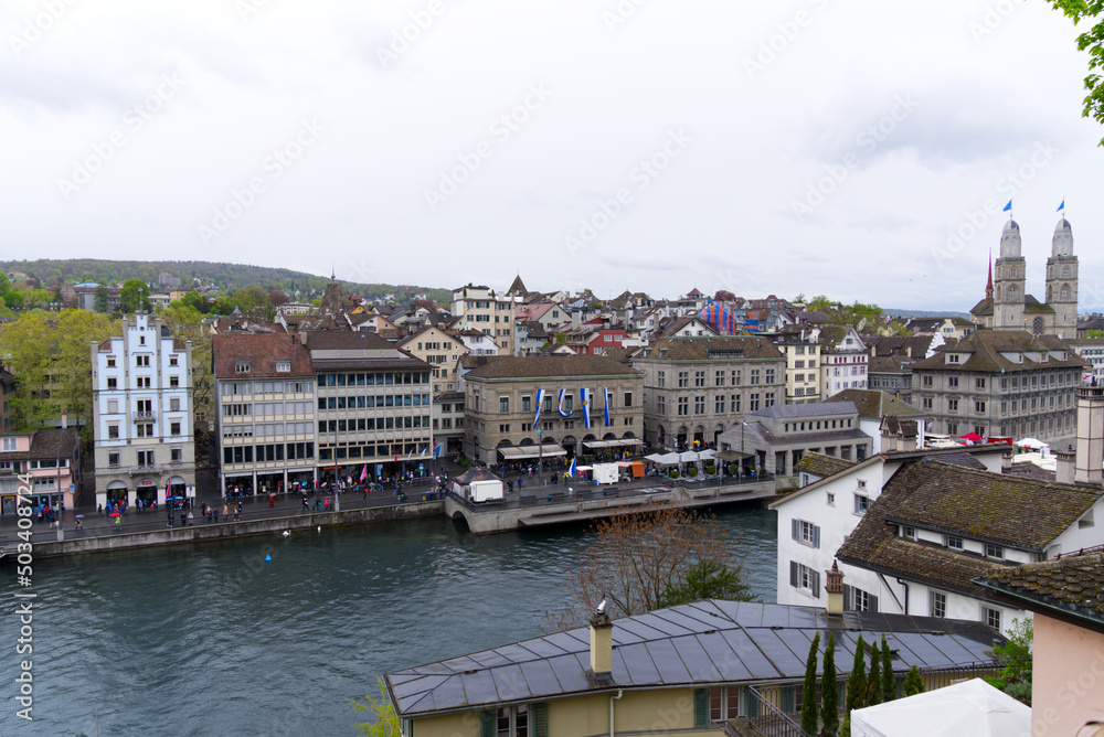 Children's parade of famous spring festival at Limmat Quay with guest Canton Uri at City of Zürich on a rainy spring day. Photo taken April 24th, 2022, Zurich, Switzerland.