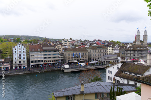 Children's parade of famous spring festival at Limmat Quay with guest Canton Uri at City of Zürich on a rainy spring day. Photo taken April 24th, 2022, Zurich, Switzerland.