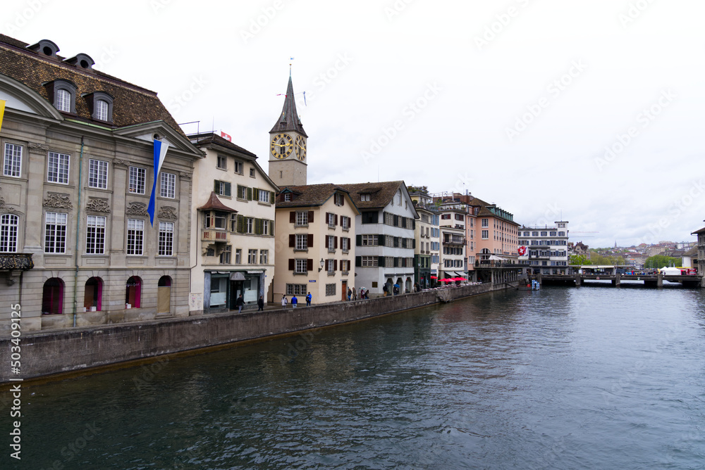 Old town of City of Zürich with river Limmat in the foreground on a rainy spring day. Photo taken April 24th, 2022, Zurich, Switzerland.