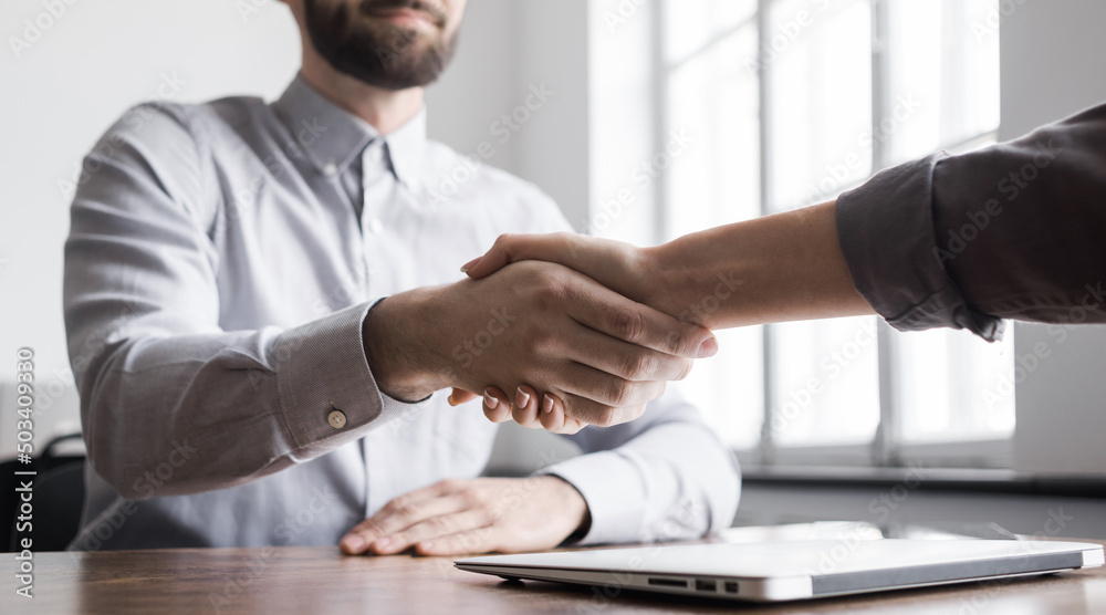 Businessman handshake and business people shaking hands while working panoramic banner. Successful business concept Businessman handshake and business people shaking hands while working panoramic banner. Successful business concept