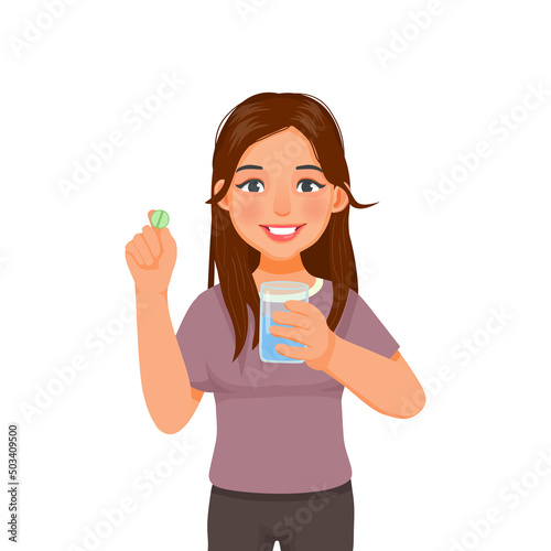 Beautiful young woman holding pills on her hand ready taking medicine with a glass of water