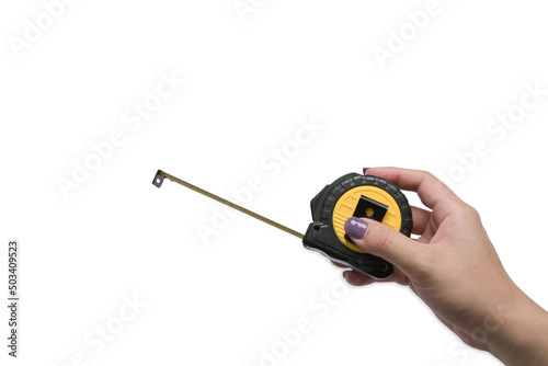 Female hand holding a tape measure isolated on white background.