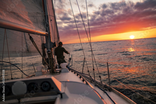 Fototapeta Naklejka Na Ścianę i Meble -  Yacht in the sea during Sunset in the Baltic Sea