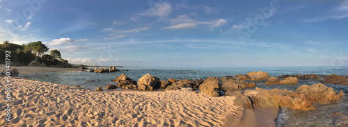 Canvas Print panoramic view on a Corsica  beach  with rock in the sea - summer vacation