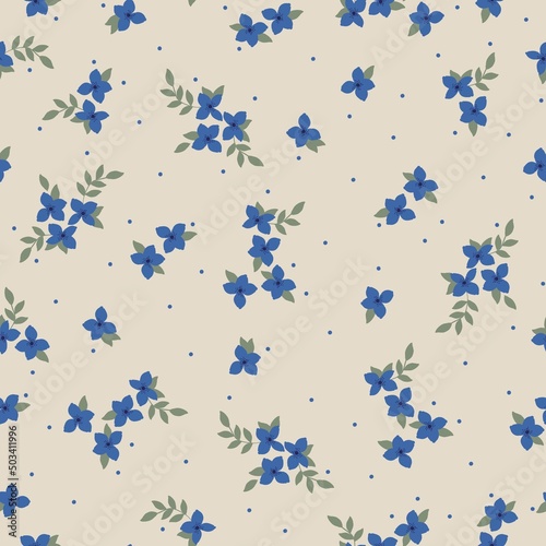 Seamless vintage pattern. Blue flowers and dots, green leaves. Beige background. vector texture. fashionable print for textiles, wallpaper and packaging.