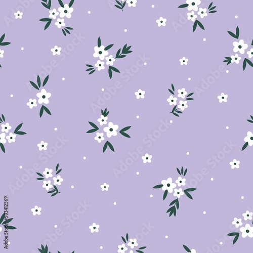 Seamless vintage pattern. Small white flowers and dots, green leaves. Lilac background. vector texture. fashionable print for textiles, wallpaper and packaging.