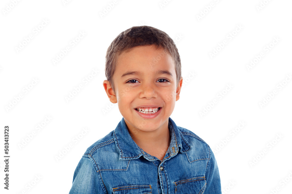 Latin child with denim shirt looking at camera and laughing Latin child with denim shirt looking at camera and laughing