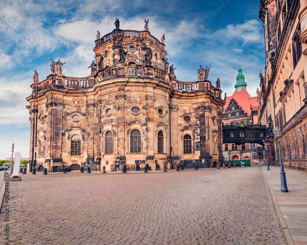Gorgeous cityscape of Dresden with Katholische Hofkirche Cathedral. Summer morning scene of capital of Saxony, Germany, Europe. A street in the city center and the old buildings of Dresden.