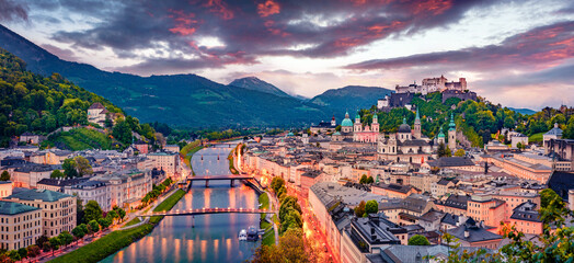 Leinwandbilder Lavendelfarbene Motive Panoramic summer cityscape of Salzburg, Old City, birthplace of famed composer Mozart. Great sunset in Eastern Alps, Austria, Europe. Adorable evening landscape with Salzach river.  © Andrew Mayovskyy