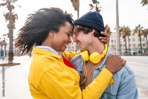 Smiling woman with Afro hairstyle enjoying leisure time with man