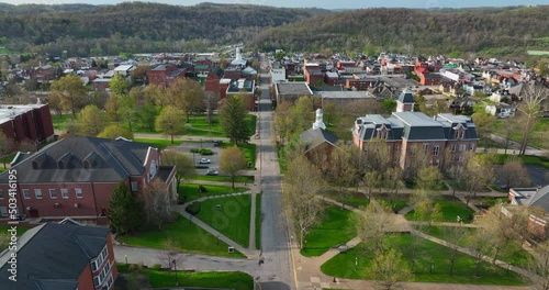 Waynesburg University college campus in small mountain town in Appalachia. Aerial in spring. photo