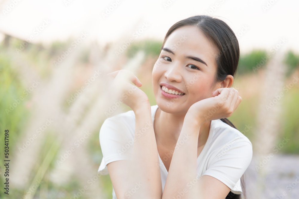 Happy smiling east asian woman in outdoor summer Happy smiling east asian woman in outdoor summer