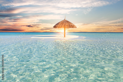 Fototapeta Naklejka Na Ścianę i Meble -  Sandbank island with umbrella in Maldives at sunset