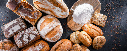 Assorted bakery products including loafs of bread and rolls