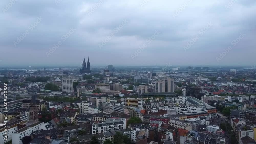 Drone shot of cloudy Cologne, Germany - drone is circling around the city, showing the Cologne Dom. Snippet could be used for travel related videos or Cologne movies. Drone shot of cloudy Cologne, Germany - drone is circling around the city, showing the Cologne Dom. Snippet could be used for travel related videos or Cologne movies.