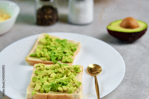 Toasts with avocado on white plate, Healthy food and dieting concept, Organic product