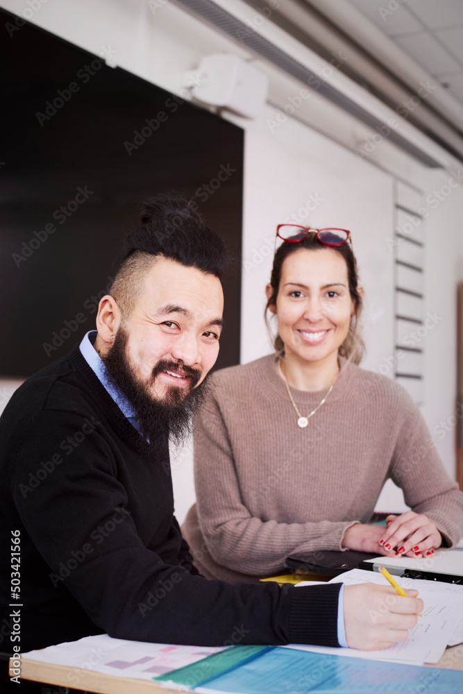 Smiling teachers in classroom