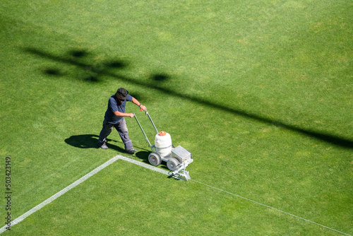 Painting line on a soccer pitch photo