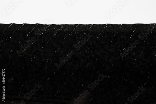 Obraz na plátně Abstract black and white contract geometric nature background with water drops flow and fall as diagonal stripes from roof