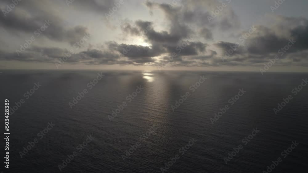 Sunrise over the sea. Epic view of the ocean and reflection of clouds and sun. Sunrise over the sea. Epic view of the ocean and reflection of clouds and sun.