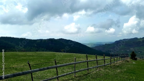 Spring mountain landscape with wooden fences and clouds on mountain Ozren, near Sarajevo, Bosnia and Herzegovina