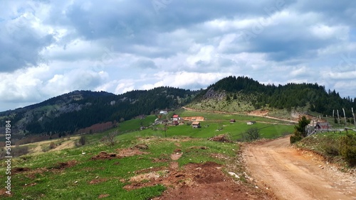 Landscape with unpaved road, clouds and sky on mountain Ozren near Sarajevo, Bosnia and Herzegovina