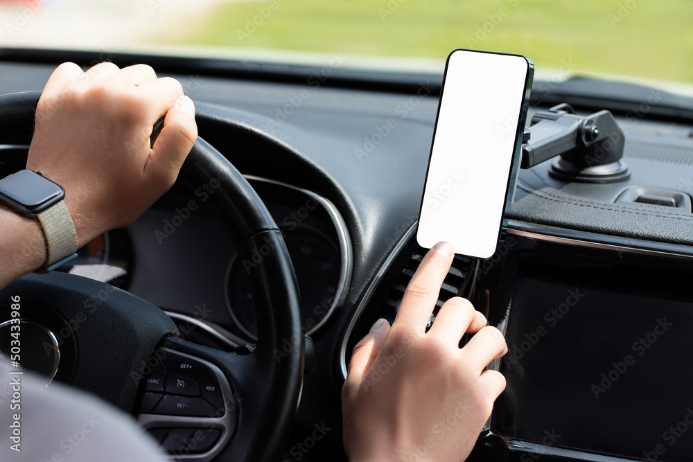 Naklejka premium Man using phone in car