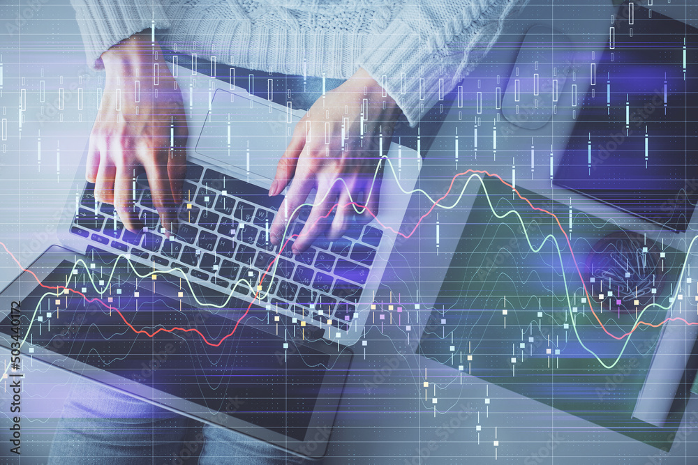 Multi exposure of woman hands working on computer and forex chart hologram drawing. Top View. Financial analysis concept. Multi exposure of woman hands working on computer and forex chart hologram drawing. Top View. Financial analysis concept.