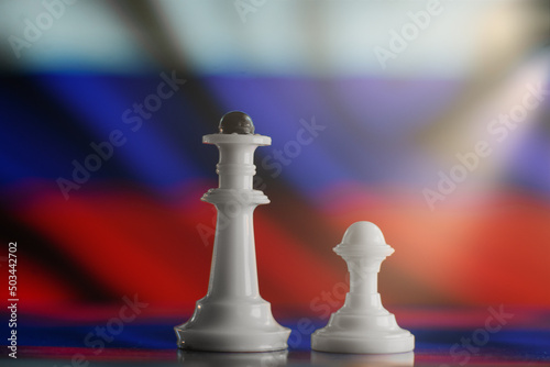 Chess pieces against the background of the ensign of Russia. Concept