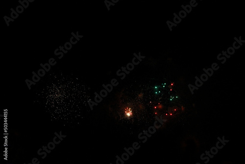 Celebration firework in the black night sky