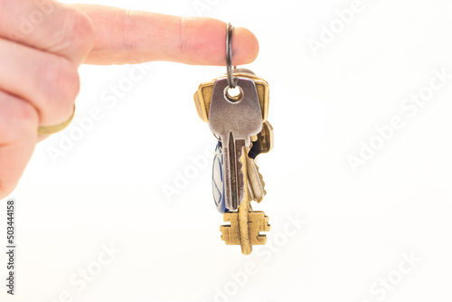 Man hold a Bunch of keys isolated on the white background
