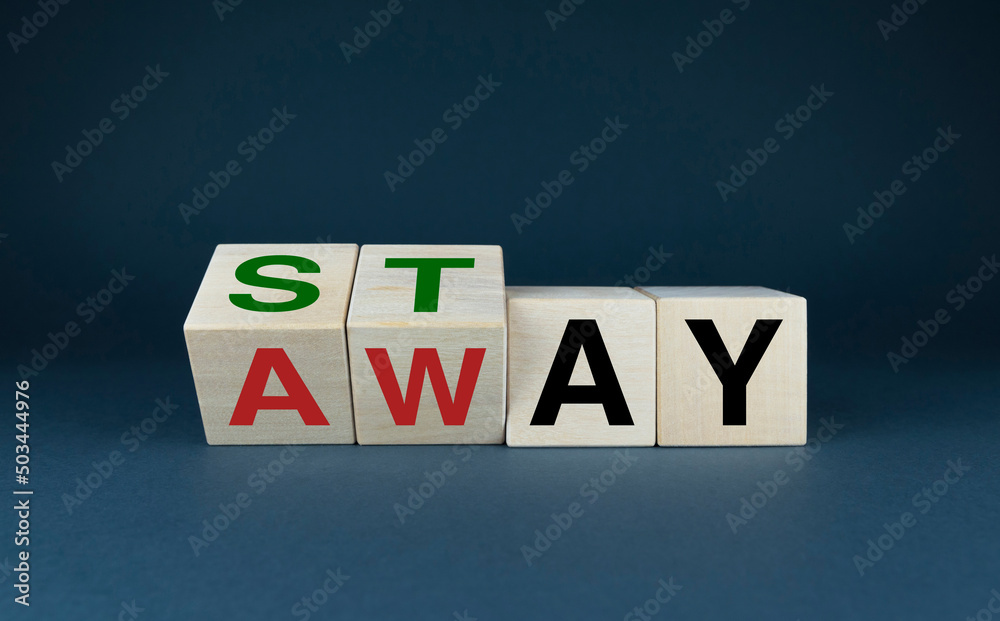 Obraz premium Cubes form the words Stay or Away. The concept of social problems and lifestyle