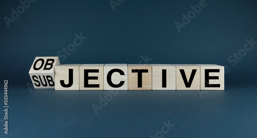 Cubes form the words Objective or Subjective. Concept of information and business photo