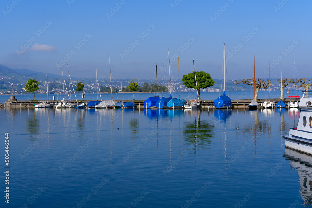 Port at City of Rapperswil with port and scenic view over Lake Zürich on a sunny spring morning. Photo taken April 28th, 2022, Rapperswil, Switzerland.