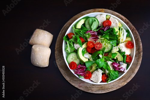 Healthy salad with vegetables and avocado. Diet food.