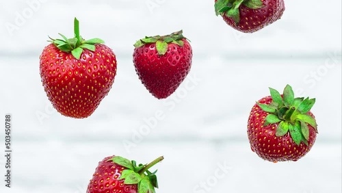 Falling strawberry isolated on white background, selective focus