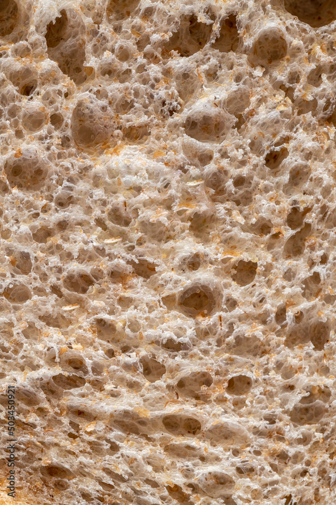 Texture of brown bread baked from wheat flour. High resolution brown bread texture background. Texture of brown bread baked from wheat flour. High resolution brown bread texture background.