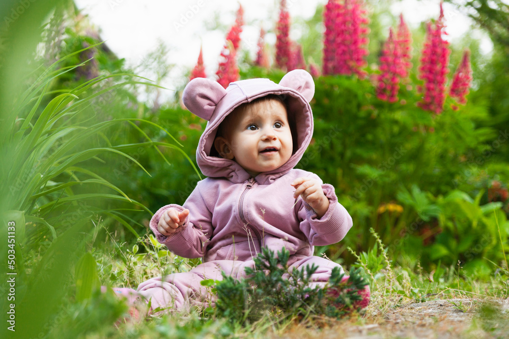 Beautiful happy toddler baby girl wearing a pink hoodie Beautiful happy toddler baby girl wearing a pink hoodie