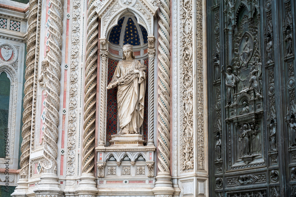 Statue and historic facade of the cathedral