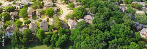 Panorama view an established neighborhood with matured trees and two story houses in Flower Mound, Texas