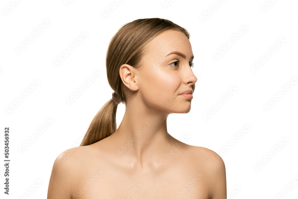 Portrait of young female fashion model without makeup isolated on white studio background. Spa, surgery, face lifting and skin care concept Portrait of young female fashion model without makeup isolated on white studio background. Spa, surgery, face lifting and skin care concept