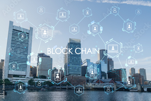 Panoramic picturesque city view of Boston Harbour at day time, Massachusetts. Building exteriors of financial downtown. Technological, educational center. Blockchain and cryptography concept, hologram