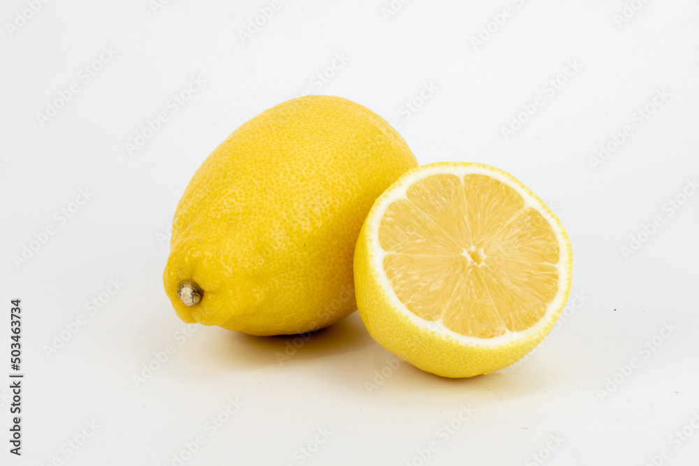 Fresh Meyer lemon, is a hybrid citrus fruit native to China. It is a cross between a citron and a mandarin pomelo hybrid, isolated in white background, shot in macro using studio setup. Fresh Meyer lemon, is a hybrid citrus fruit native to China. It is a cross between a citron and a mandarin pomelo hybrid, isolated in white background, shot in macro using studio setup.