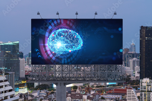Brain hologram on billboard with Bangkok cityscape background at sunset. Street advertising poster. Front view. The largest science hub in Southeast Asia. Coding and high-tech science.