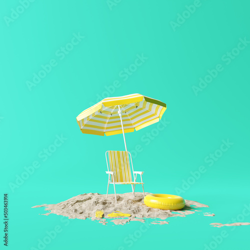 Fotografie Beach umbrella with chairs and beach accessories on blue background