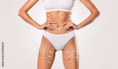 Slimming. Closeup of Unrecognizable Lady Posing With Drawn Arrows photo